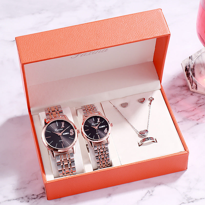Elegant watch and jewelry gift set in an orange box, perfect for special occasions and celebrations.