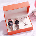 Elegant watch and jewelry gift set in an orange box, perfect for special occasions and celebrations.