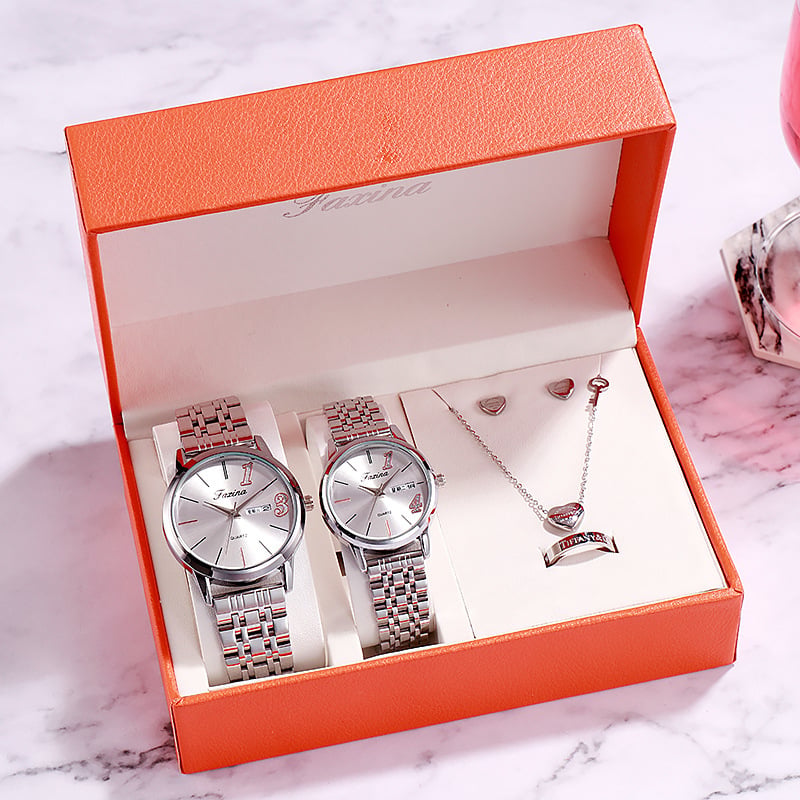 Watch and jewelry gift set featuring two elegant watches and matching jewelry in a stylish orange box.