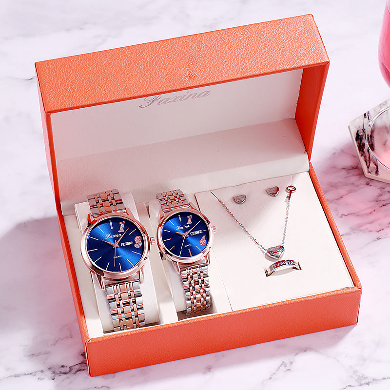 Watch and jewelry gift set displayed in a beautiful orange box with blue watches and silver jewelry.